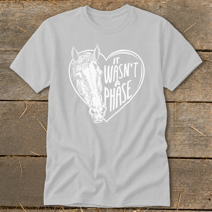 Light grey t-shirt with white horse head and text "IT WASN'T A PHASE" inside a heart.