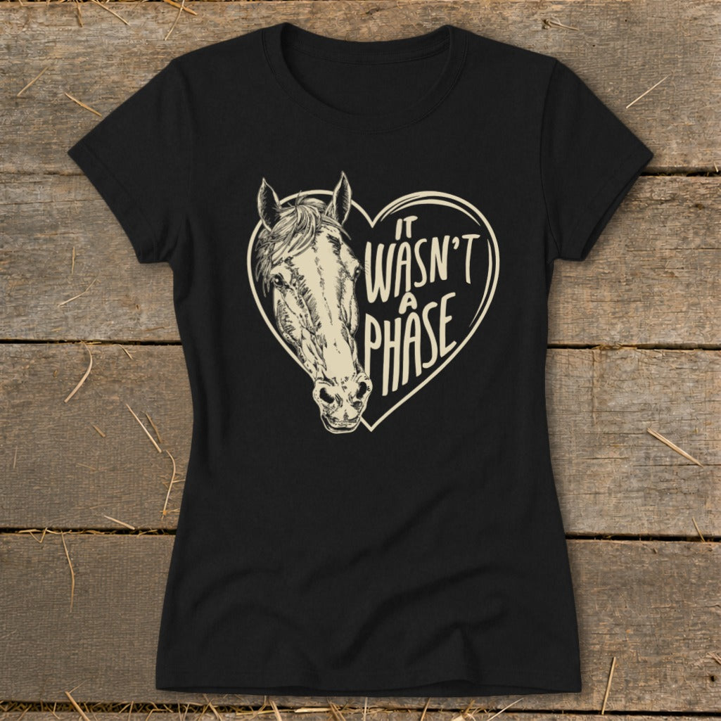 Black t-shirt with a horse head inside a heart and text "it wasn't a phase."