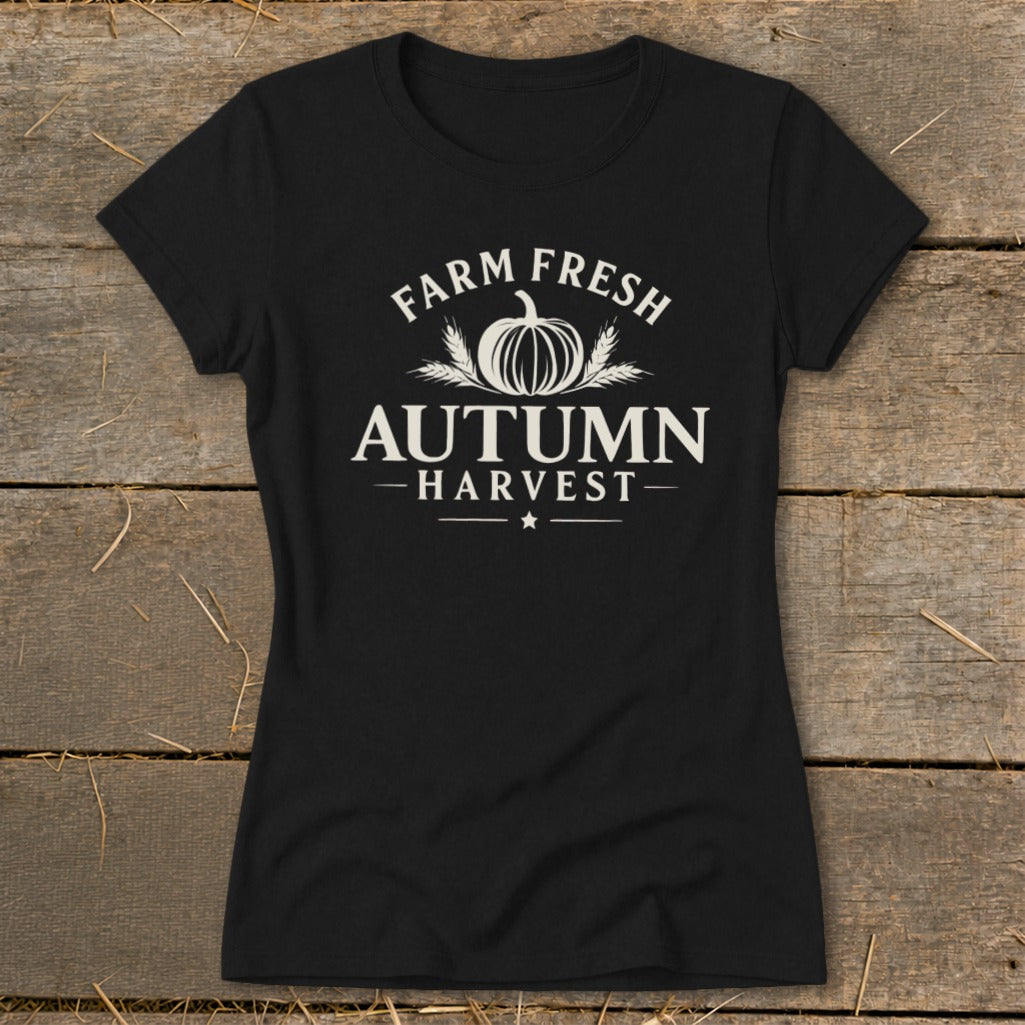 Black t-shirt with white text "Farm Fresh Autumn Harvest" and a pumpkin graphic.