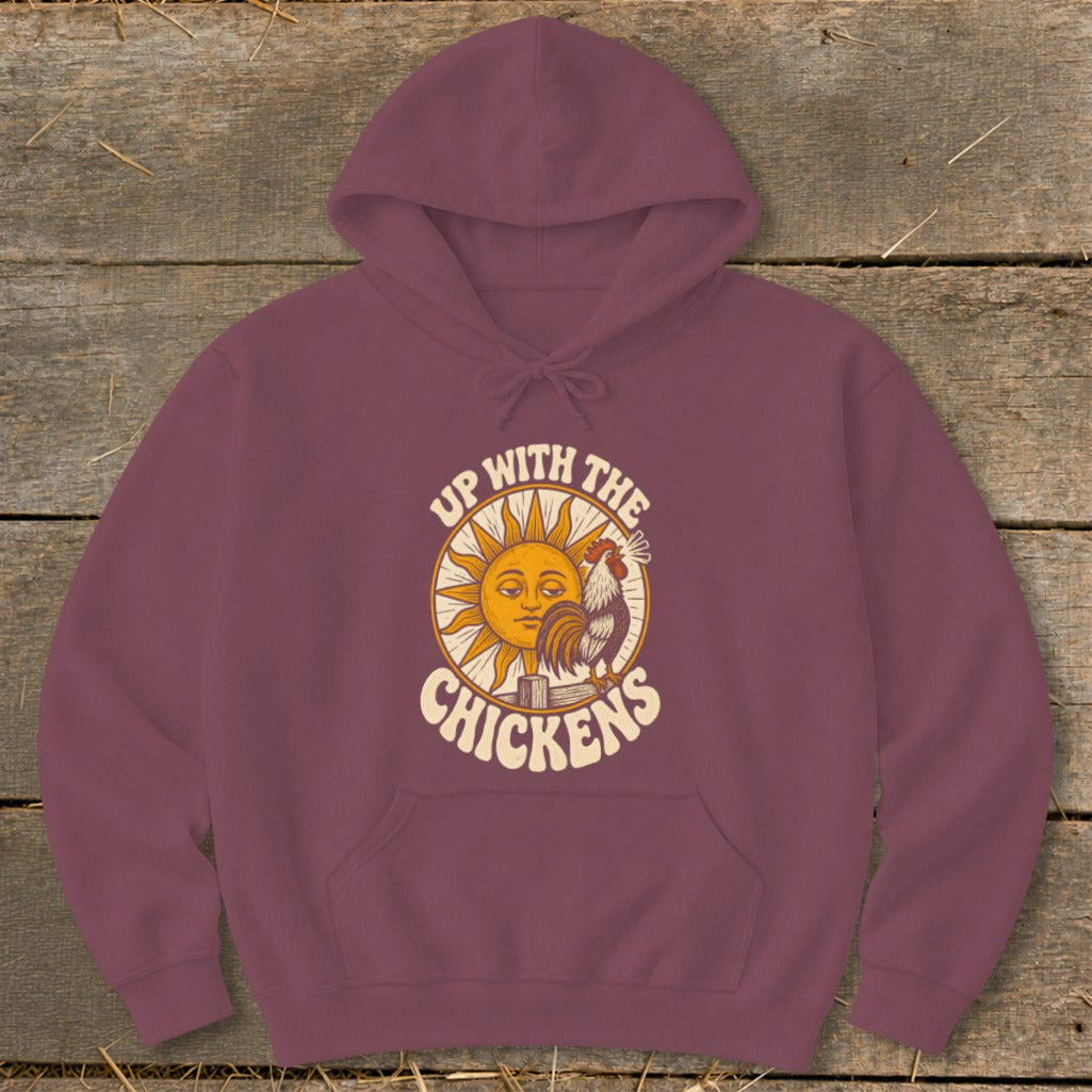 Maroon pullover hoodie with a graphic of a sun, rooster, and the text Up With The Chickens.