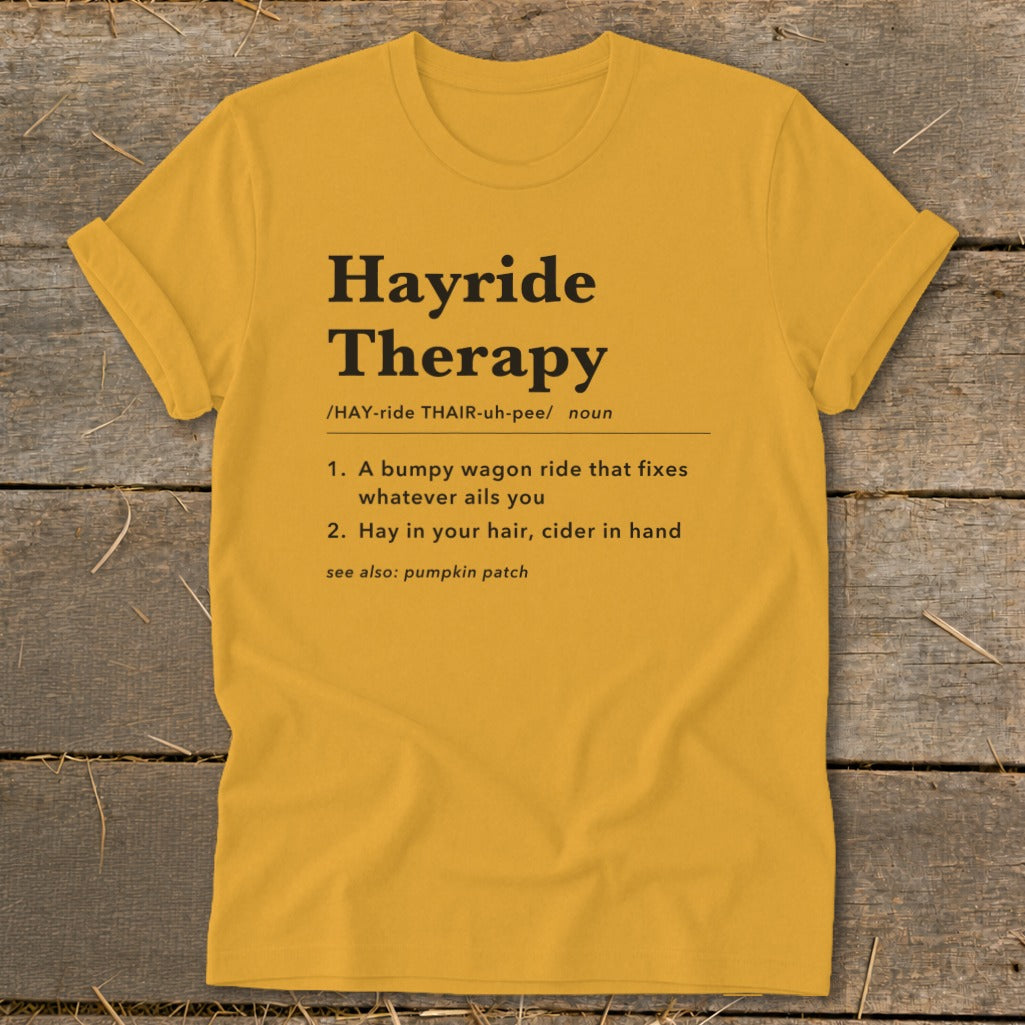 Yellow t-shirt with "Hayride Therapy" dictionary definition and related phrases.