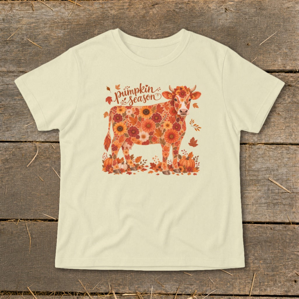 Cow covered in fall flowers and leaves with "pumpkin season" text.