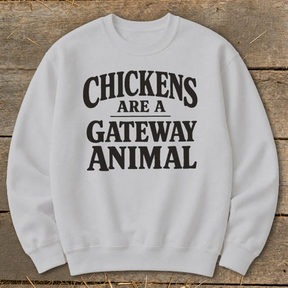 White sweatshirt with black text that reads "Chickens are a gateway animal".