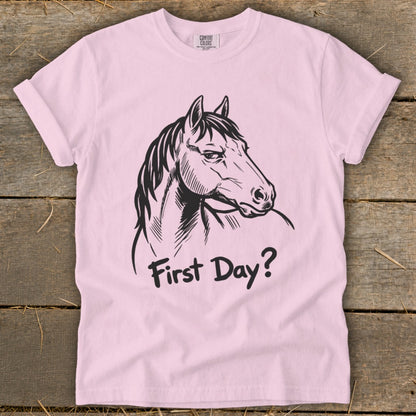 Pink t-shirt with black horse head and "First Day?" text.