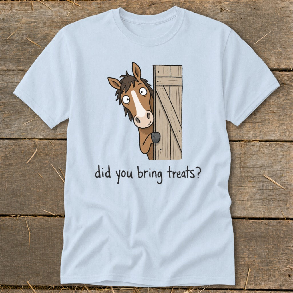 Light blue t-shirt with a cartoon horse peeking from behind a wooden gate, asking "did you bring treats?".