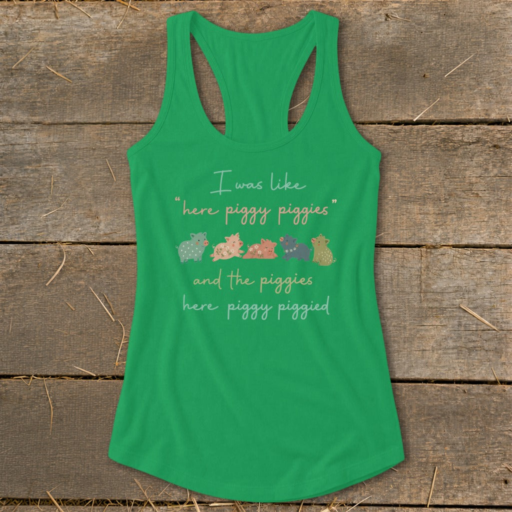 Green tank top with text and five colorful patterned pigs.