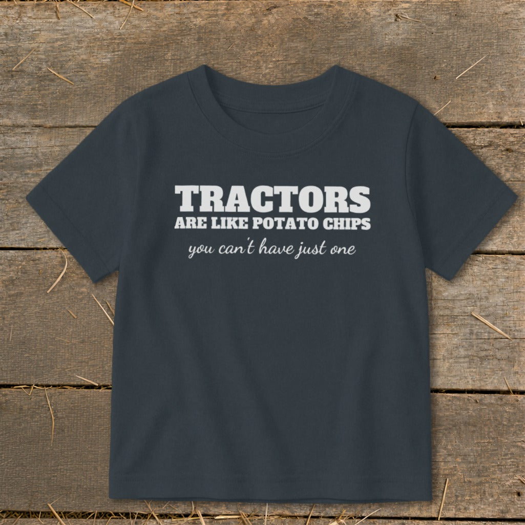Dark gray t-shirt with white text "Tractors are like potato chips, you can't have just one."