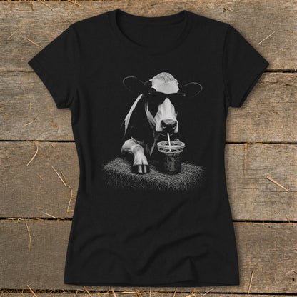 Black t-shirt with a graphic of a cow wearing sunglasses drinking a beverage.