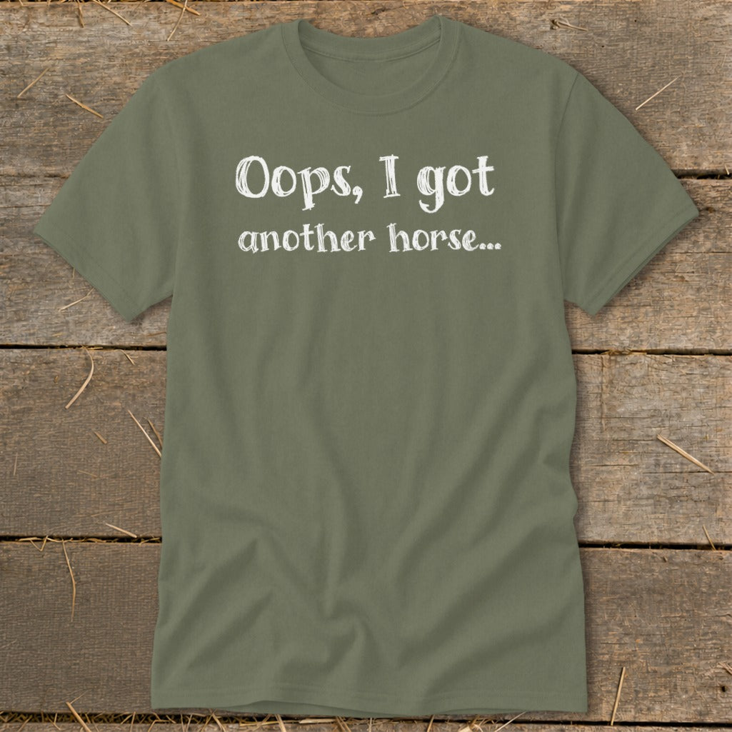 Olive green t-shirt with white text "Oops, I got another horse..."