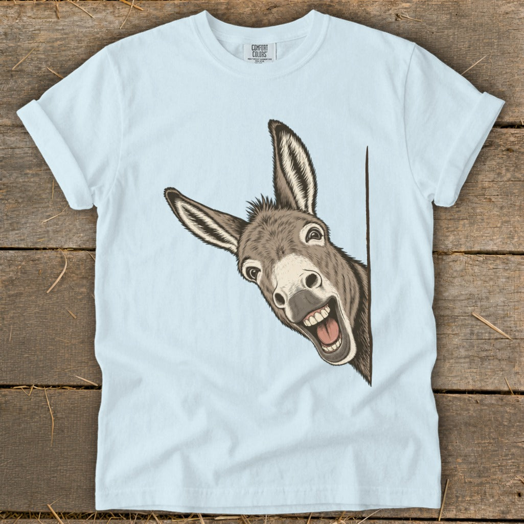 Light blue t-shirt with a drawing of a happy donkey peeking from the side.