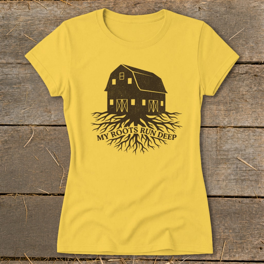 Yellow t-shirt with a dark graphic of a barn with roots and text "MY ROOTS RUN DEEP".