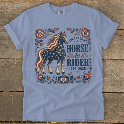 Light blue t-shirt with a design of a horse adorned with stars and stripes.