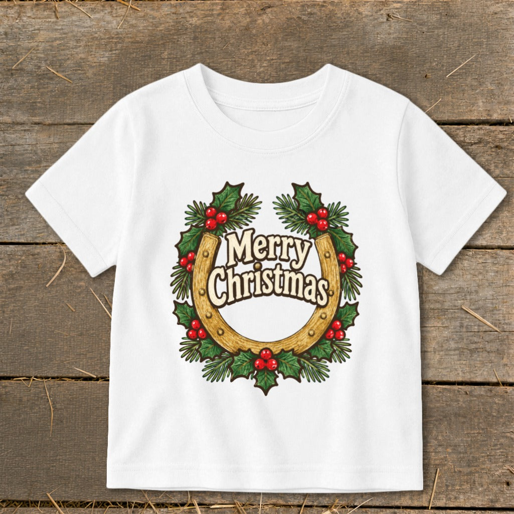 White t-shirt with a Christmas wreath design around a horseshoe.