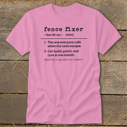Pink t-shirt with definition of "fence fixer" and related humorous text.