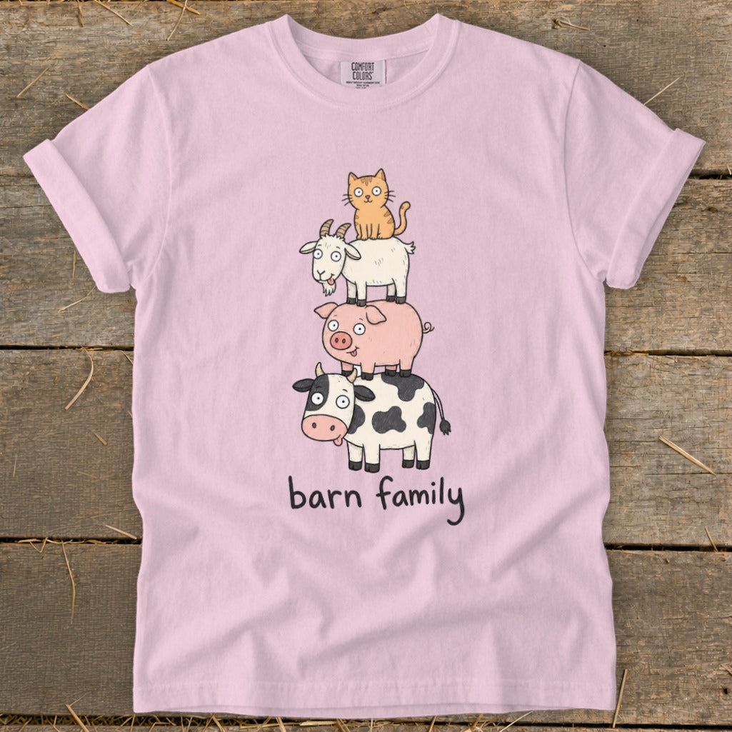 Pink t-shirt with a cow, pig, goat, and cat stacked on top of each other, text "barn family."