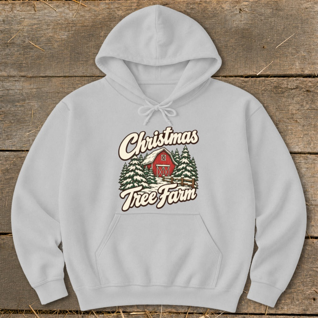 Light grey hoodie with "Christmas Tree Farm" graphic of a red barn and pine trees.