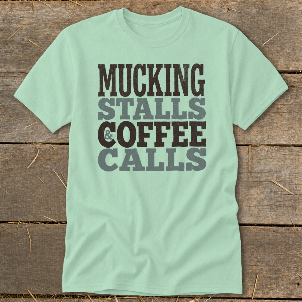 Mint green t-shirt with text: Mucking Stalls & Coffee Calls.
