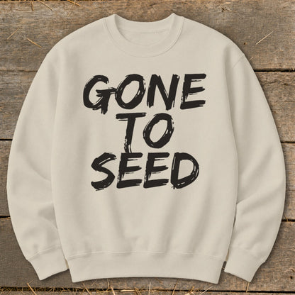 Cream sweatshirt with black text reading "GONE TO SEED" in a distressed font.