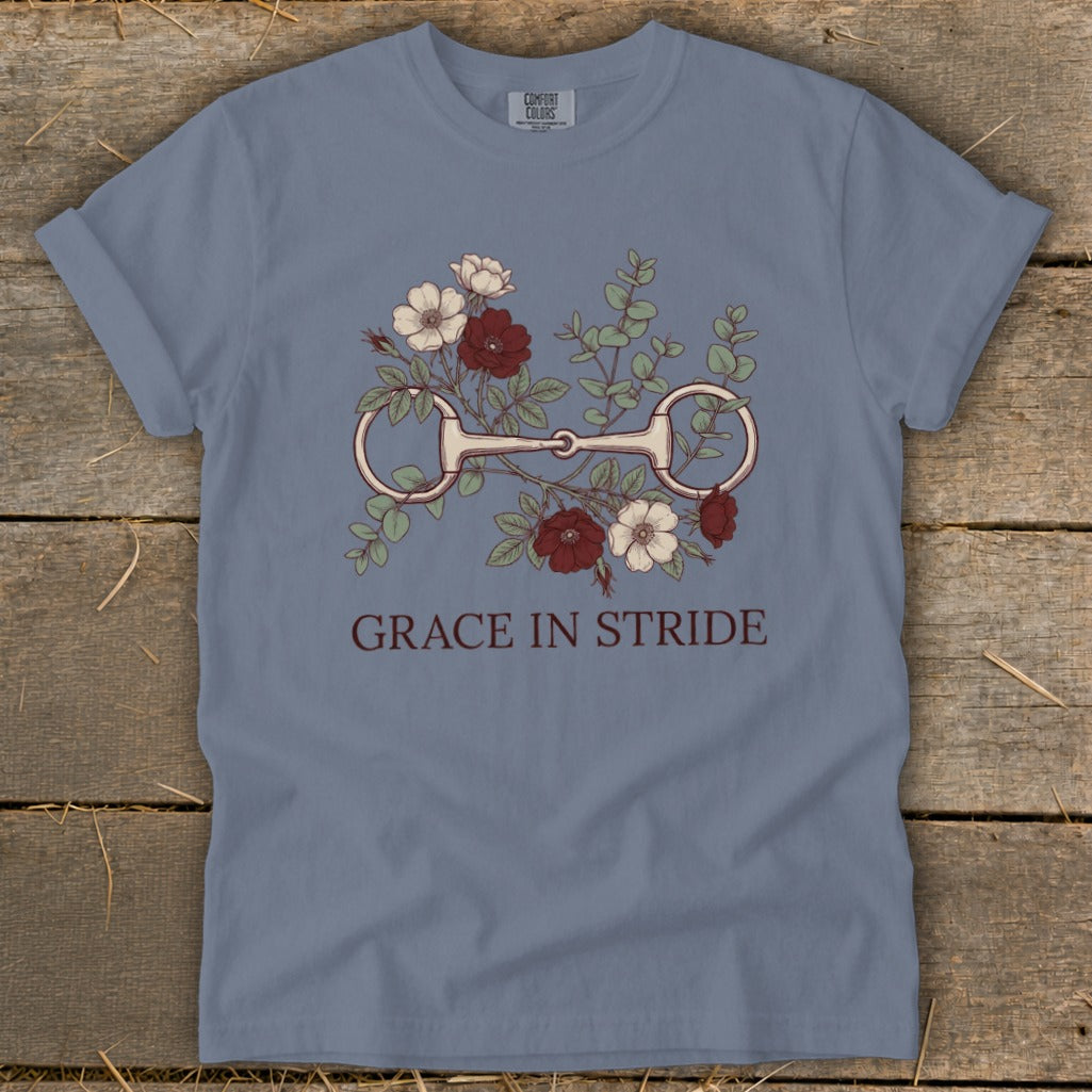 Blue t-shirt with horse bit and floral graphic, text reads "Grace in Stride."