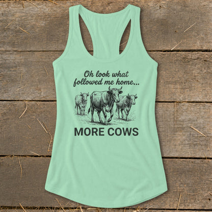 Light green tank top with sketch of three cows and text "Oh look what followed me home... MORE COWS".