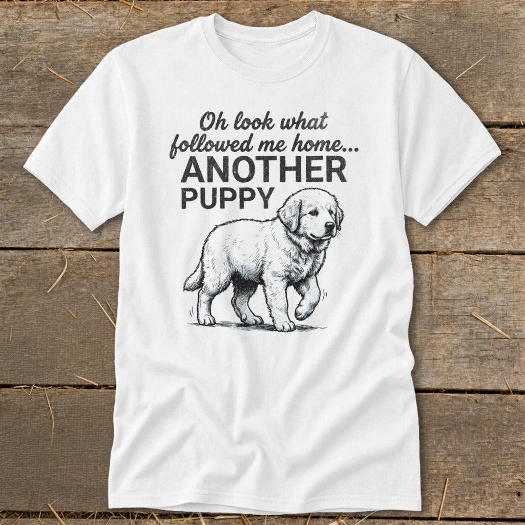 White t-shirt with text "Oh look what followed me home... ANOTHER PUPPY" and a drawing of a puppy.