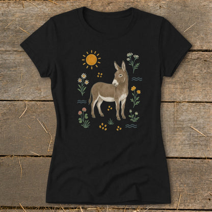 Black t-shirt with a brown donkey illustration surrounded by flowers, the sun, and wavy lines.