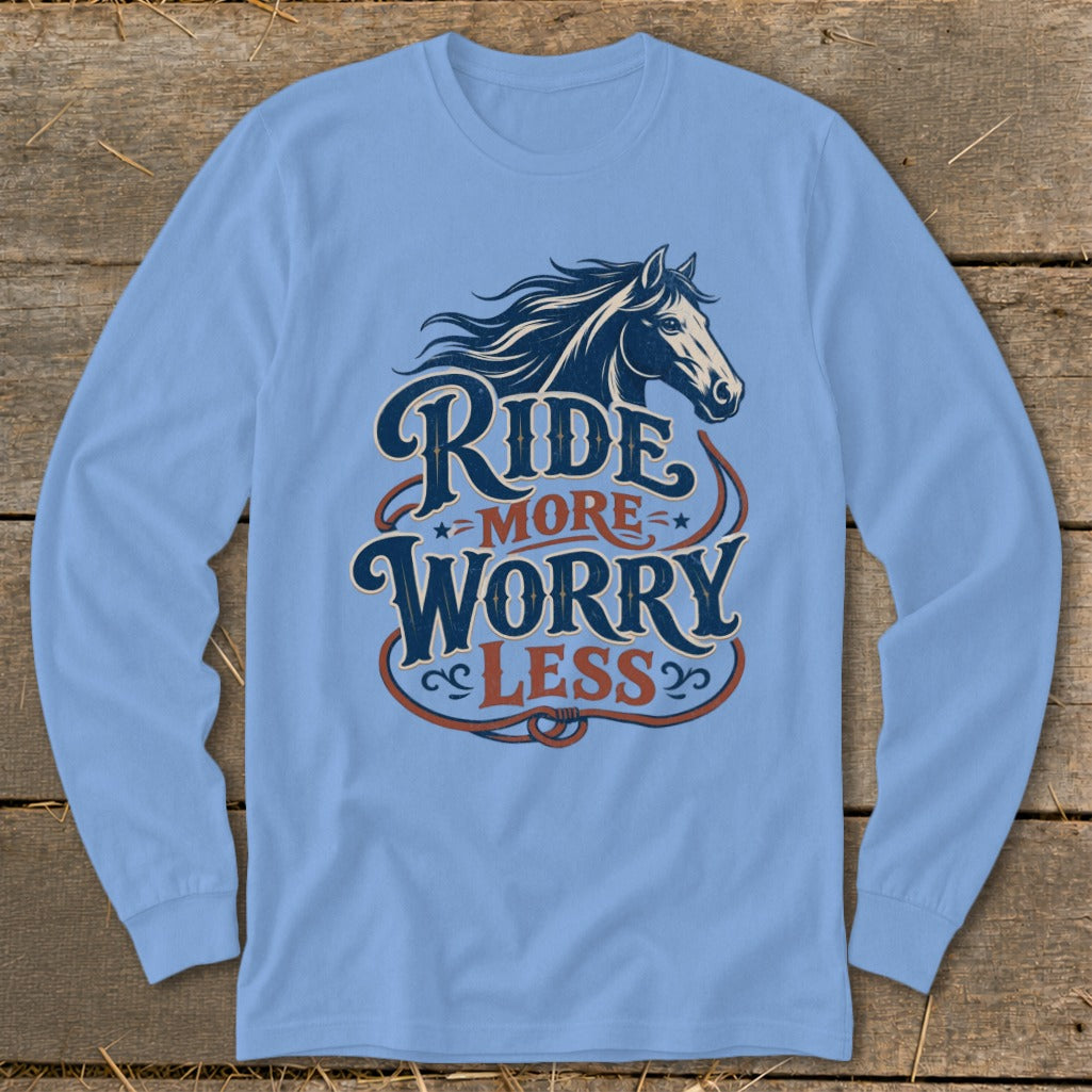 Blue long-sleeve shirt with horse graphic and text "Ride More Worry Less."