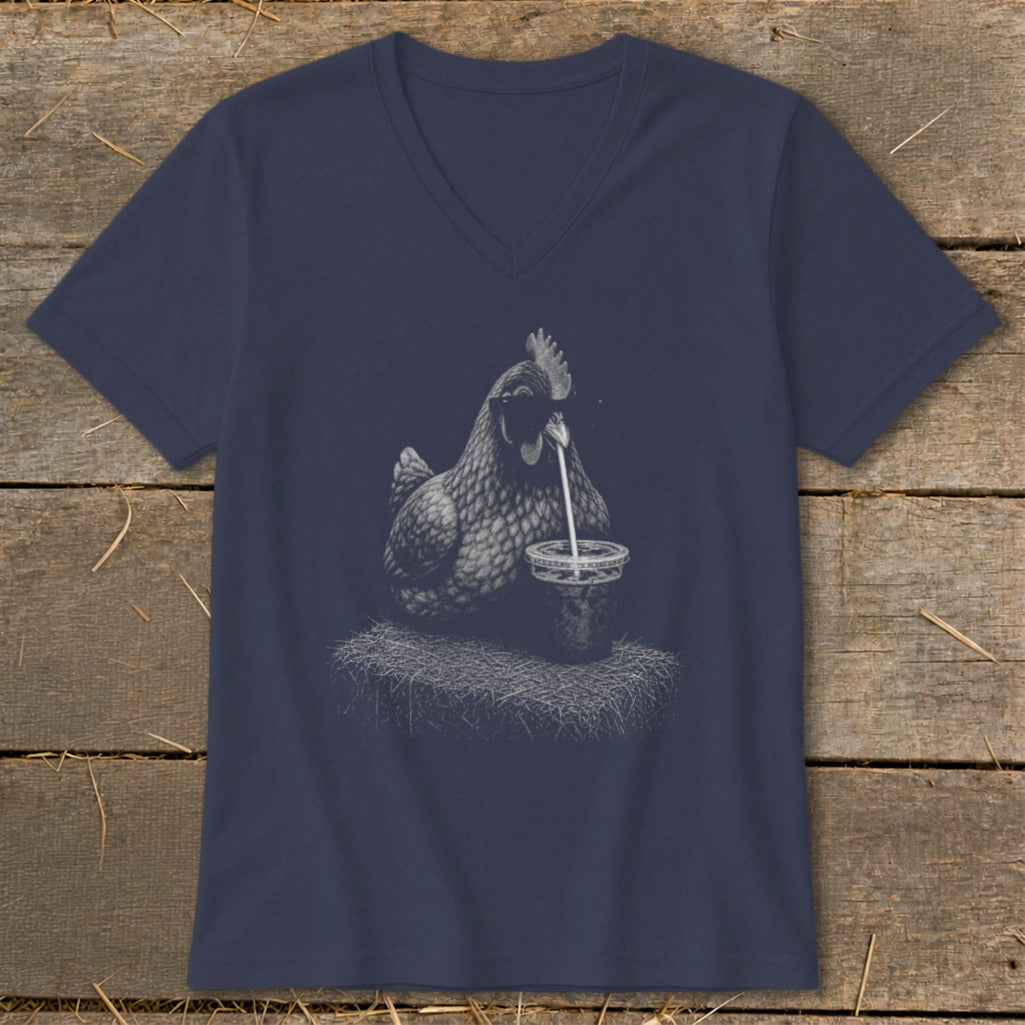 Chicken drinking from a cup with a straw on a navy blue v-neck shirt.