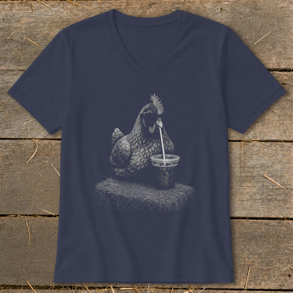 Chicken drinking from a cup with a straw on a navy blue v-neck shirt.