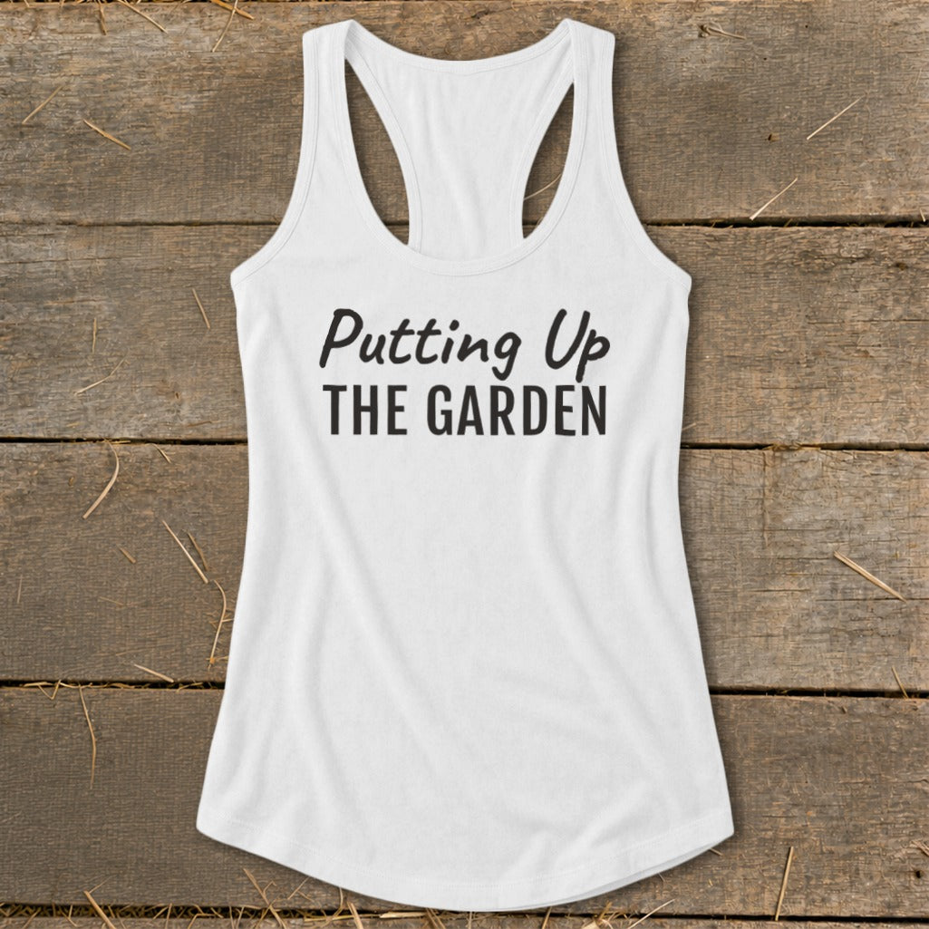 White racerback tank top with black text "Putting Up THE GARDEN".