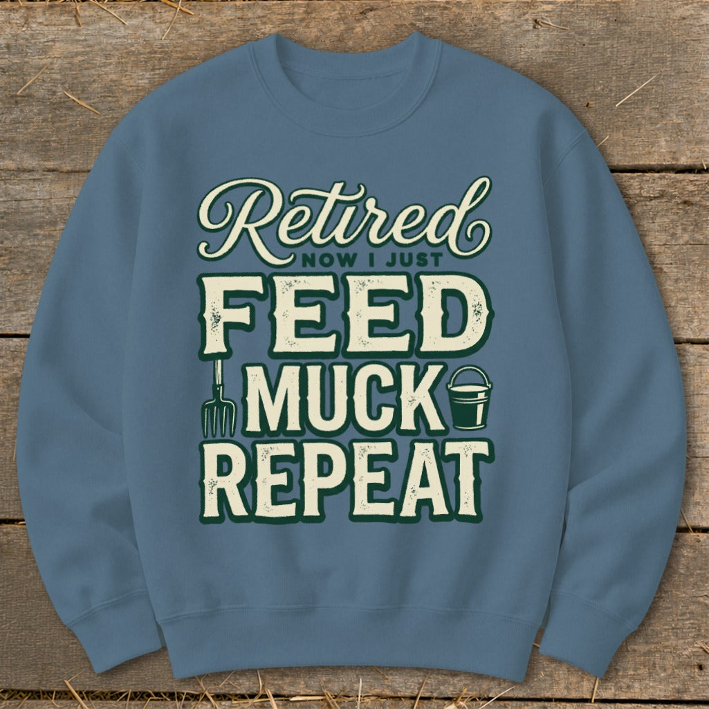 Crewneck sweatshirt with "Retired Now I Just Feed Muck Repeat" text.
