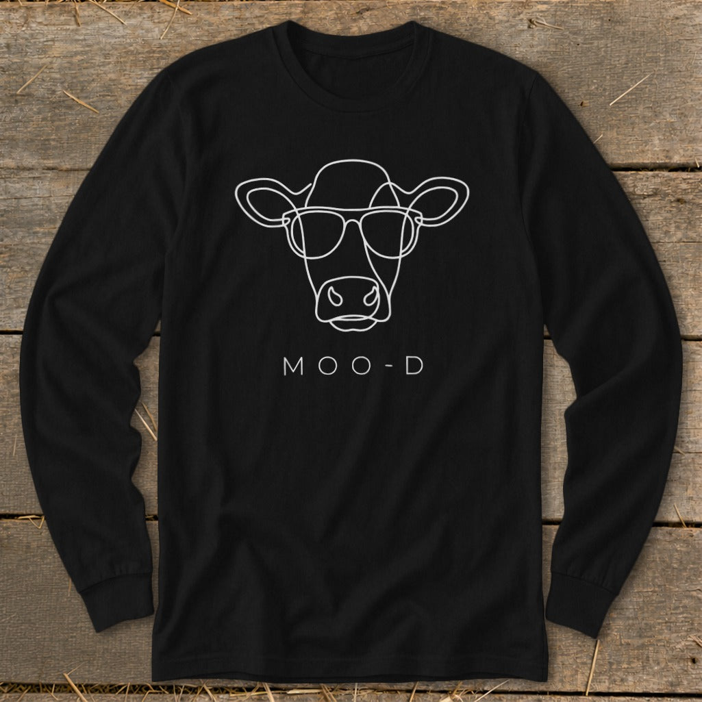Black long-sleeve shirt with white line art cow wearing glasses and text "MOO-D".