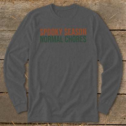 Gray long-sleeve shirt with orange and green text reading "Spooky Season Normal Chores."