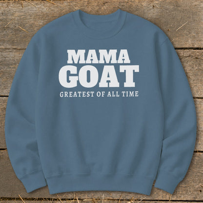 Blue sweatshirt with white text "MAMA GOAT GREATEST OF ALL TIME".