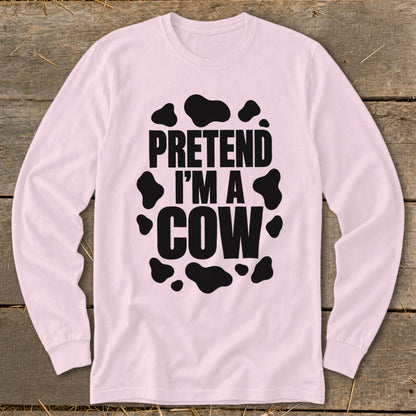 Pink long-sleeve shirt with black "Pretend I'm a Cow" text and cow spots.