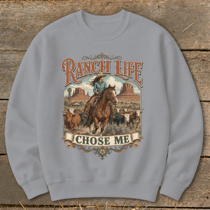Ranch Life Chose Me graphic on sweatshirt with cowboy riding horse and cows.