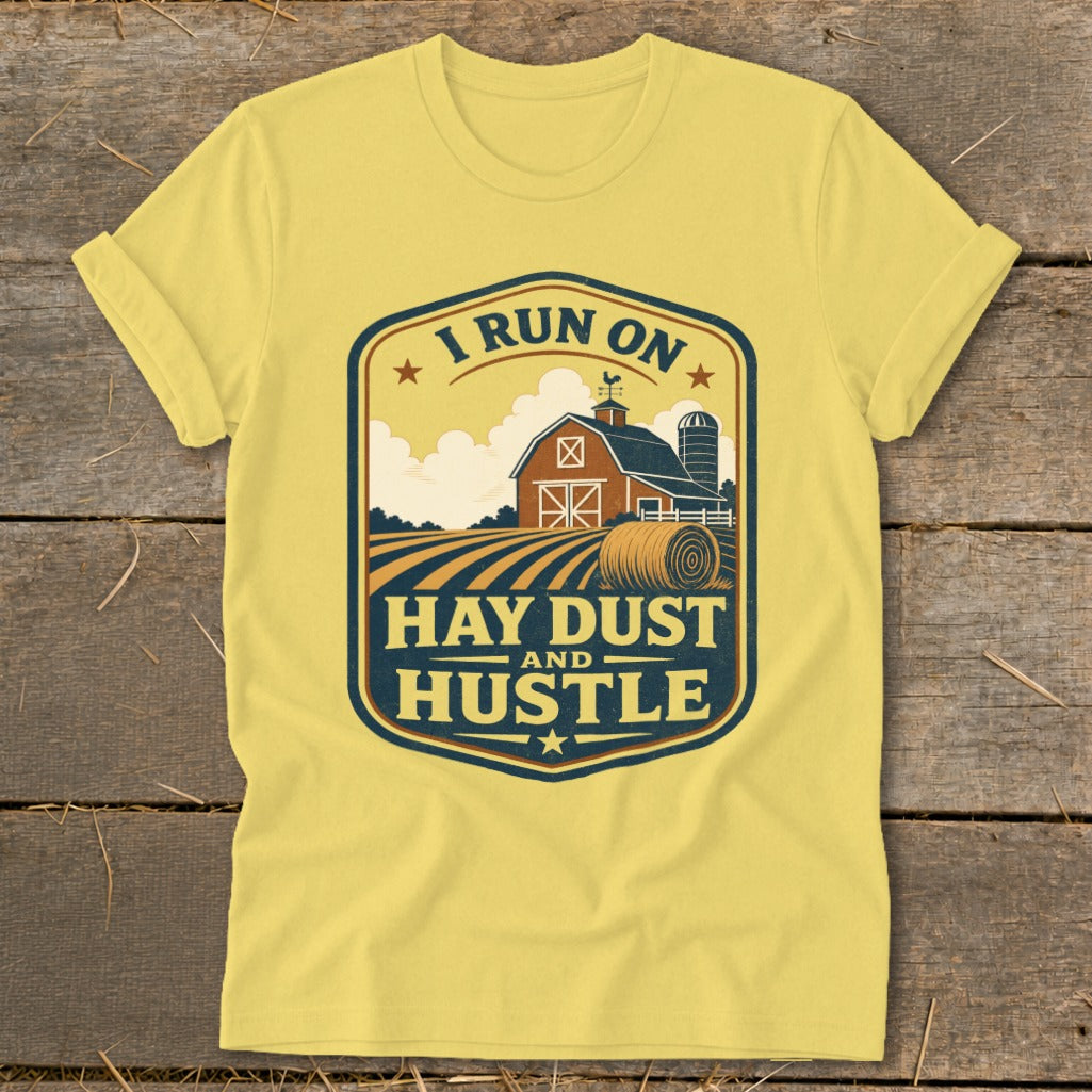 Yellow t-shirt with "I Run On Hay Dust and Hustle" farm graphic.