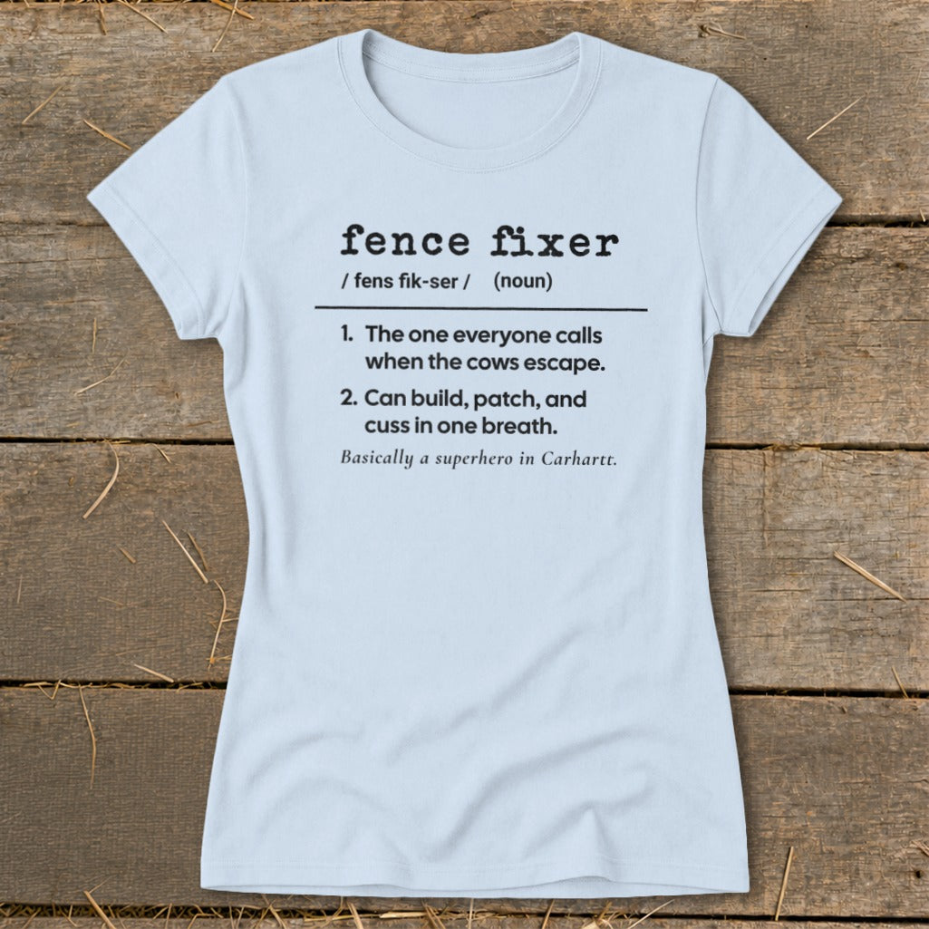 Light blue t-shirt with "Fence Fixer" definition including cows escaping and superhero mention.