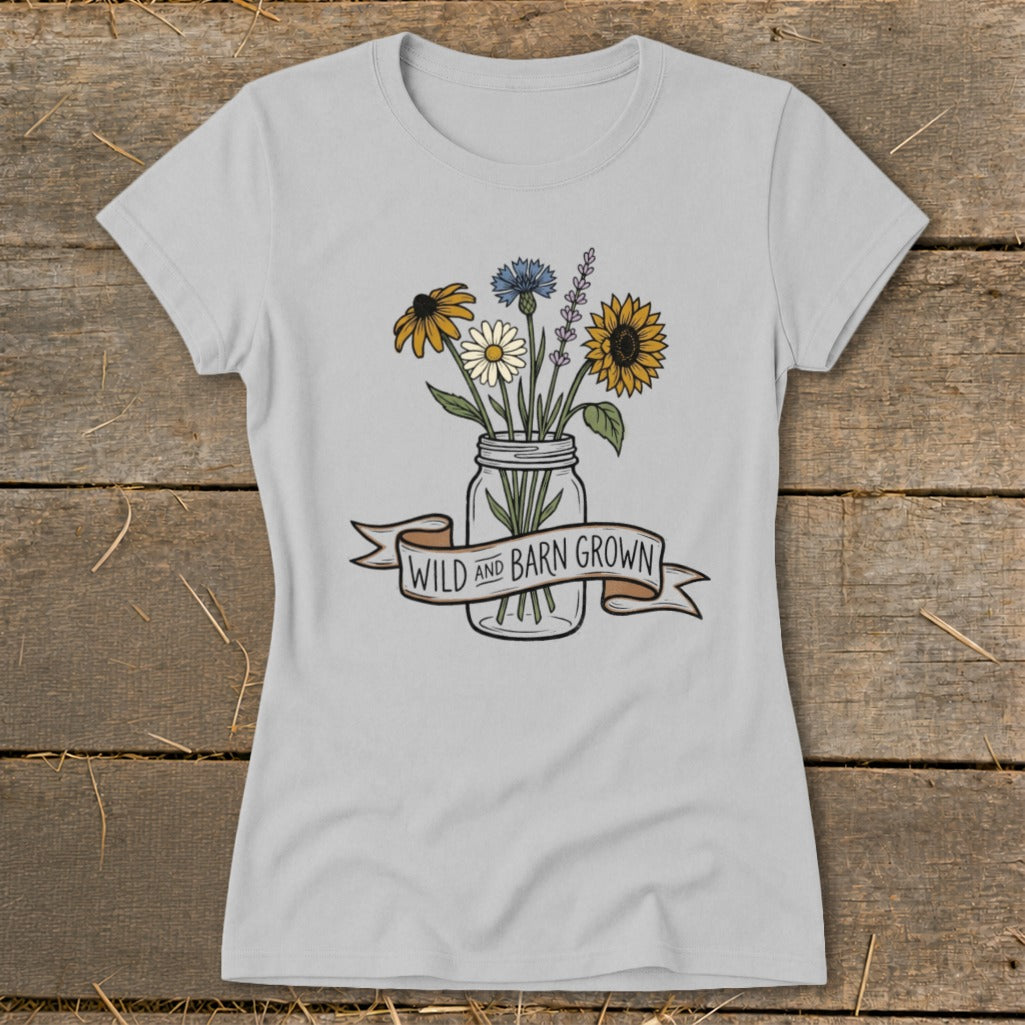 Light gray t-shirt with a mason jar of wildflowers and text that reads "WILD AND BARN GROWN".