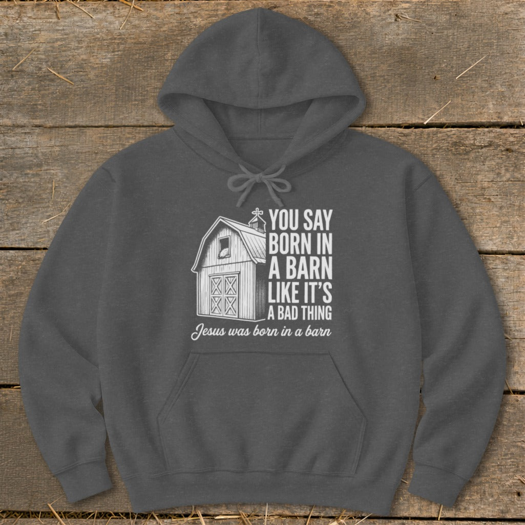 Dark gray hoodie with barn graphic and text "You say born in a barn like it's a bad thing."