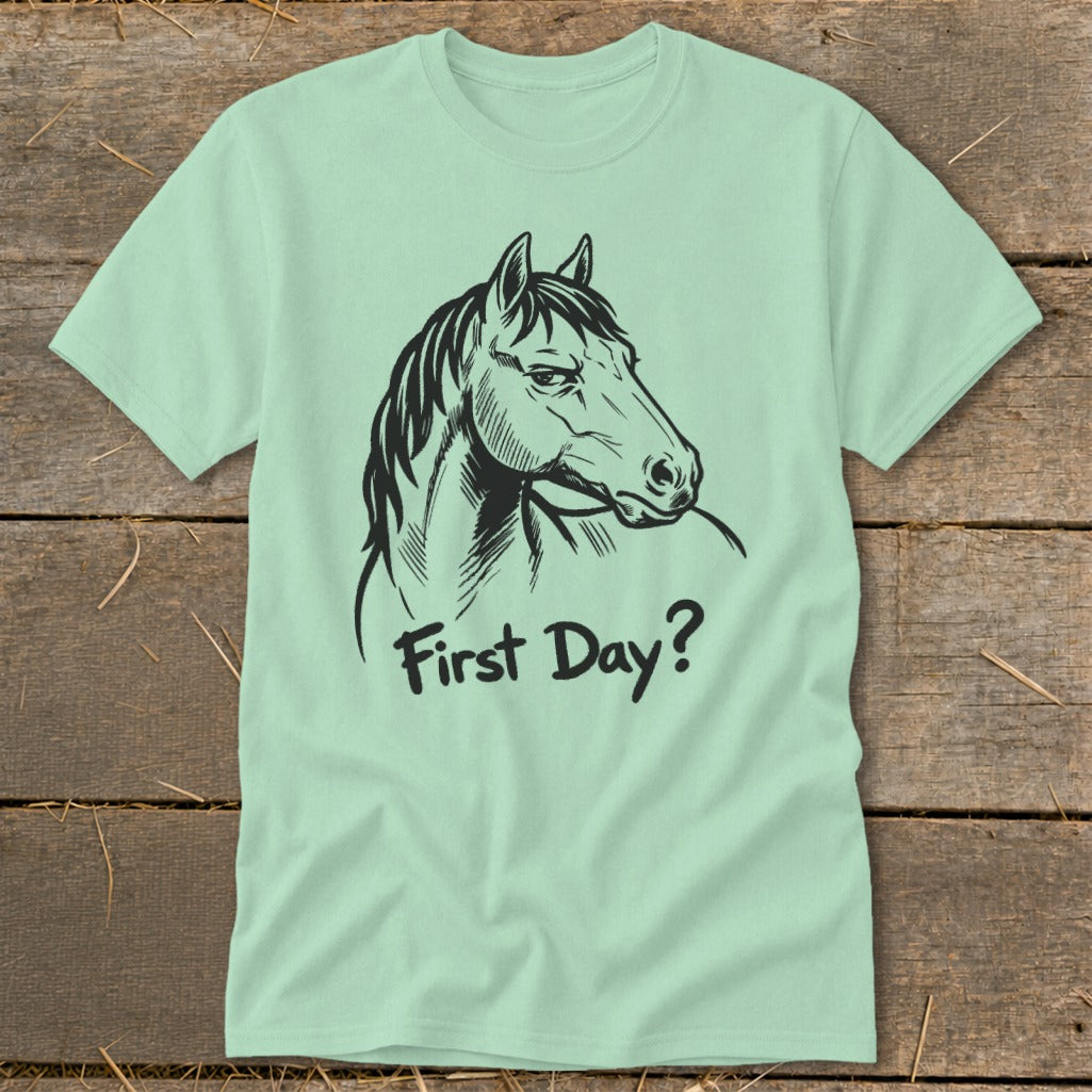 Light green t-shirt with a black line drawing of a horse's head and the text "First Day?".