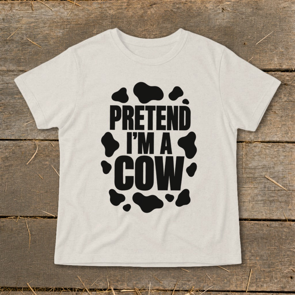 Light-colored t-shirt with "PRETEND I'M A COW" and black cow spots design.