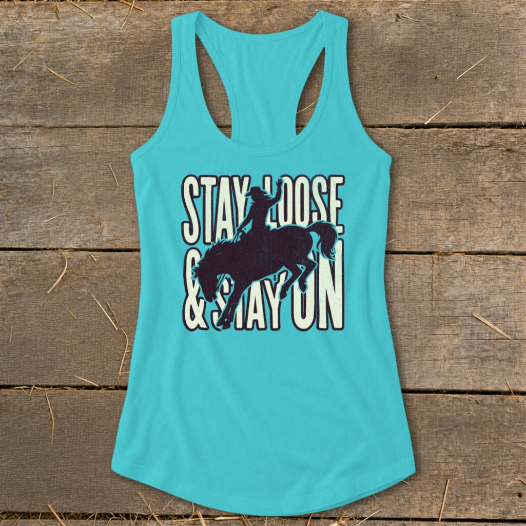 Turquoise tank top with "Stay Loose & Stay On" text and bucking bronco graphic.