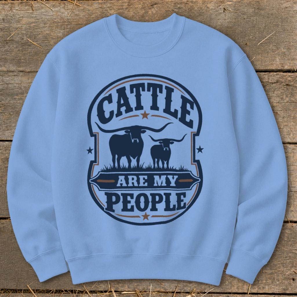 Light blue sweatshirt with "Cattle Are My People" text and two longhorn cattle silhouettes.