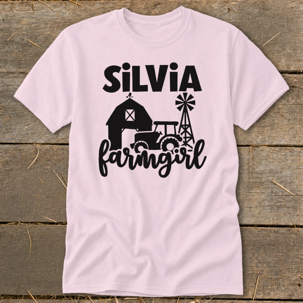 Pink t-shirt with "Silvia farmgirl" text and farm graphics.