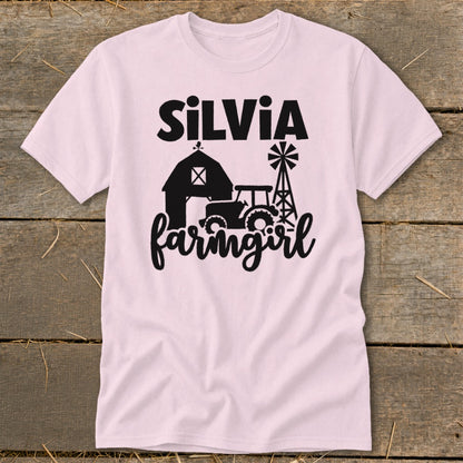 Pink t-shirt with "Silvia farmgirl" text and farm graphics.