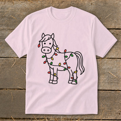 Pink t-shirt with a black outline drawing of a horse wrapped in colorful Christmas lights.