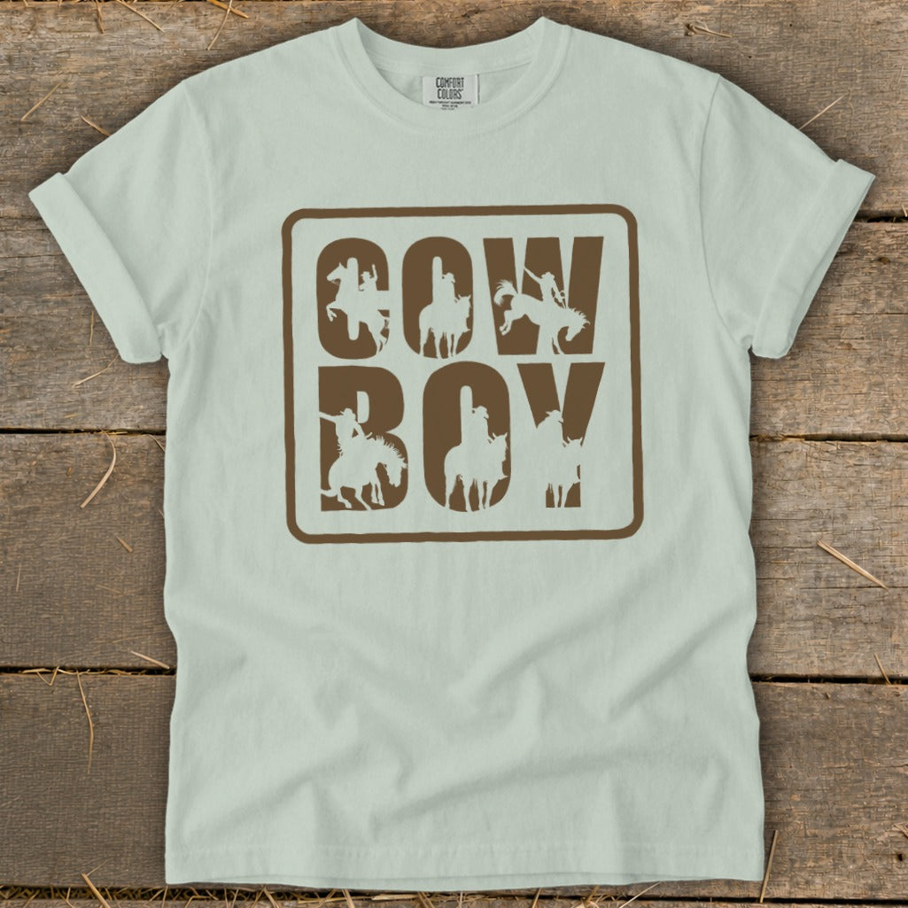 Light blue t-shirt with "COW BOY" text and horse-riding cowboy graphics.