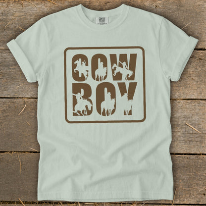 Light blue t-shirt with "COW BOY" text and horse-riding cowboy graphics.