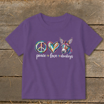 Purple t-shirt with peace sign, heart, and colorful donkey graphic; text reads "peace love donkeys".
